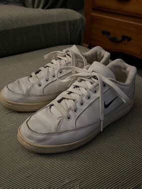 Nike White Low-Top Sneakers with Black Swoosh